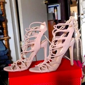 Woman's Pink high heel w/wrap around straps. size 7 only, by Nina Garcia.